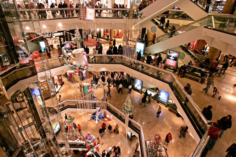 Shoppers crowd Water Tower Place shopping mall Nov. 25 in Chicago. Friday marked the start of the holiday shopping season.